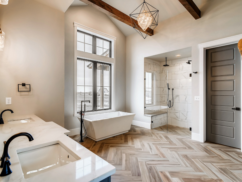Stunning bathroom with walk-in shower, freestanding tub and designer lighting